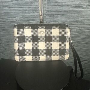 Coach Black and White L zip  Checkered Wristlet has 2 card slots.